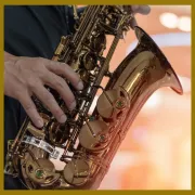 Image of a saxophone being played close up