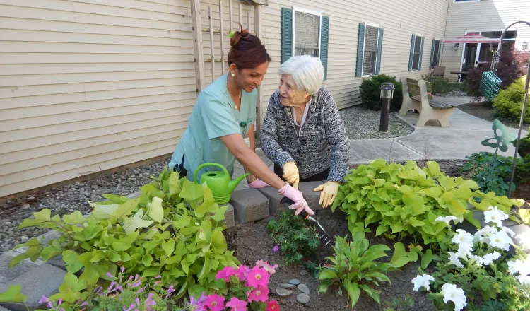 Gardening in Courtyard of Memory Care Center