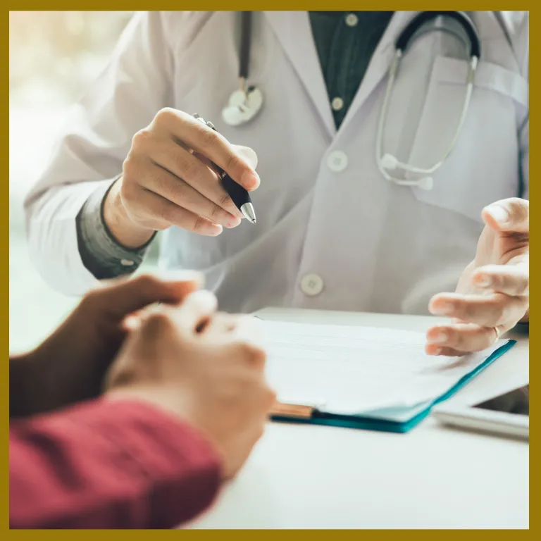 Medical professional sits with patient