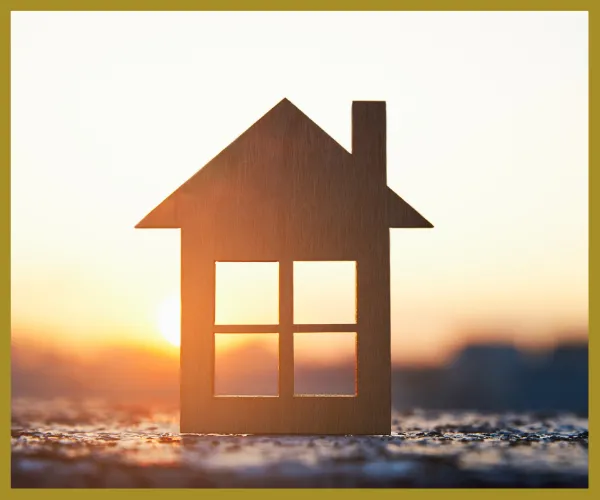 Image of a small wooden house at sunrise