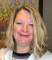 Headshot of Colleen, she has shoulder length blond hair. 